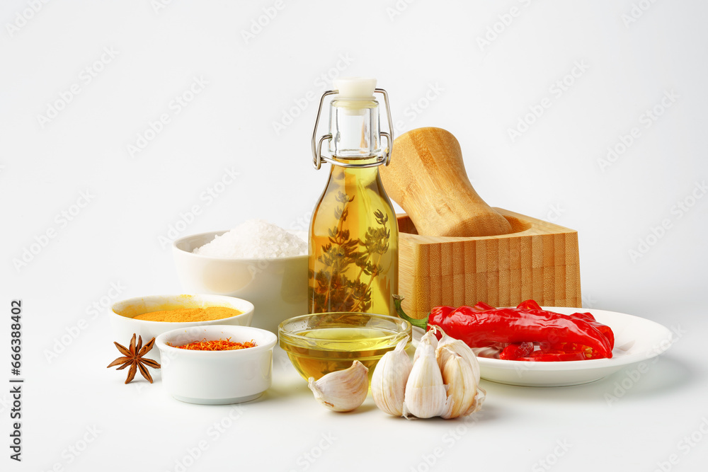 Bowls with spices and cooking ingredients on white background Bowls with spices and cooking ingredients on white background