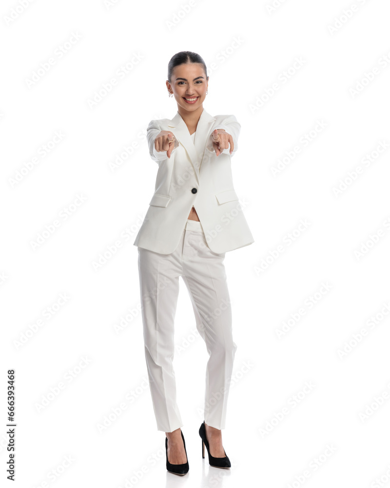 excited elegant woman smiling while pointing fingers forward excited elegant woman smiling while pointing fingers forward