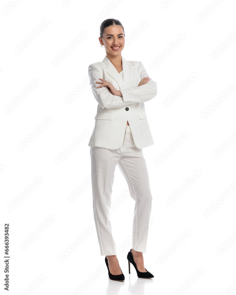 beautiful elegant girl with ponytail smiling and crossing arms beautiful elegant girl with ponytail smiling and crossing arms
