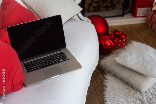Christmas decorated working space with a laptop on the desk, social media holiday concept with blank space for a text