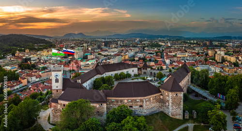 Ljubljana, Slovenia - Aerial panoramic view of Ljubljana Castle on a summer afternoon with Franciscan Church of the Annunciation, Ljubljana Cathedral and skyline of the capital of Slovenia at sunset photo