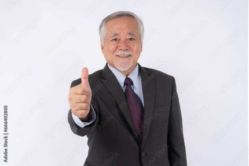 Asian senior businessman , old man with suit giving a thumb up hand on white background with copy space - lifestyle senior male concept Asian senior businessman , old man with suit giving a thumb up hand on white background with copy space - lifestyle senior male concept