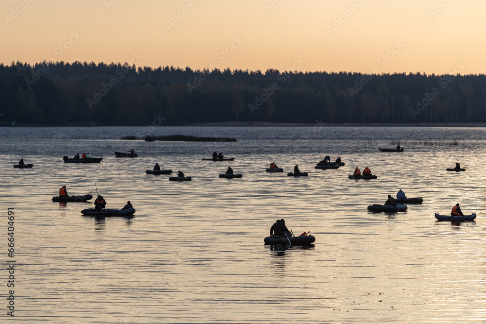 Silhouettes of Fishermen on Inflatable Boats — Sport Fishing Scene on Water Surface Silhouettes of Fishermen on Inflatable Boats — Sport Fishing Scene on Water Surface