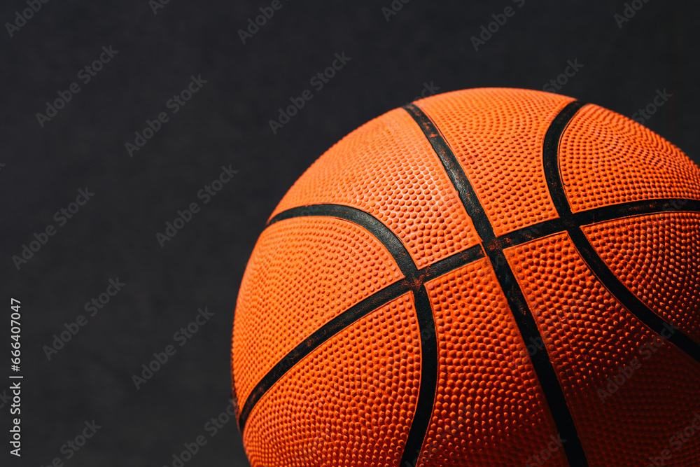 Fototapeta premium Used basketball ball on concrete surface of outdoor court