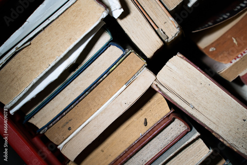 a shelf with old files and books