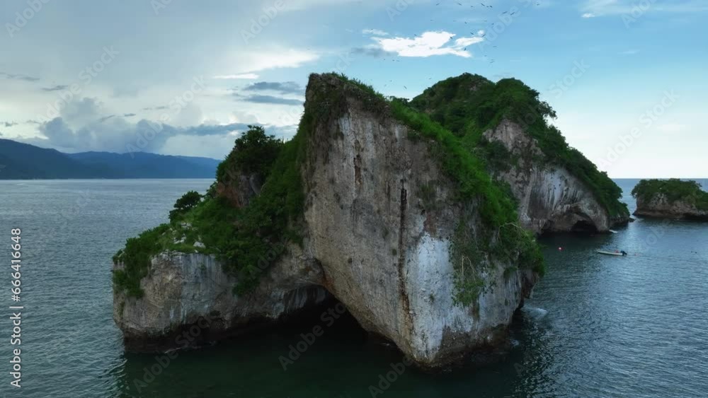 Drone shot circling the Mismalyoa arches in partly cloudy Puerto Vallarta, Mexico Drone shot circling the Mismalyoa arches in partly cloudy Puerto Vallarta, Mexico