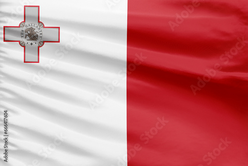 Malta flag background is depicted on a sport stitch cloth fabric with folds.