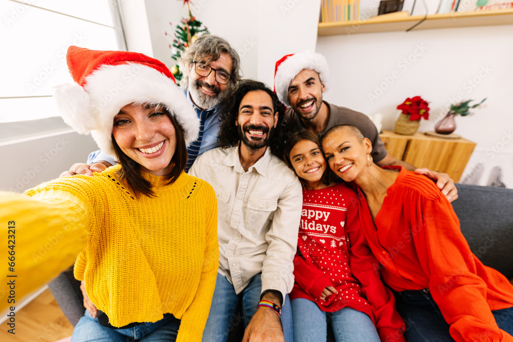 © Xavier Lorenzo - Happy family taking selfie portrait celebrating christmas together at home. Celebration and xmas concept. © Xavier Lorenzo - Happy family taking selfie portrait celebrating christmas together at home. Celebration and xmas concept.