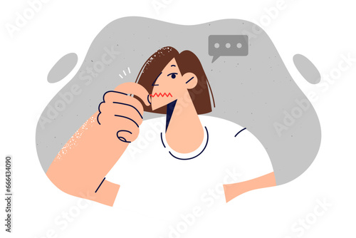 Woman closes mouth, not wanting to give away secret, or demonstrating presence censorship in society