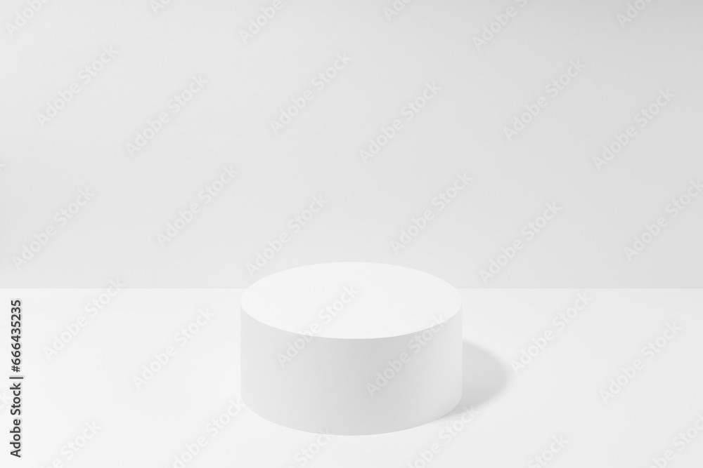 Abstract one white round podium for cosmetic products in hard light, mockup on white background. Scene for presentation products, gifts, goods, advertising, design, sale, display, showing. Abstract one white round podium for cosmetic products in hard light, mockup on white background. Scene for presentation products, gifts, goods, advertising, design, sale, display, showing.