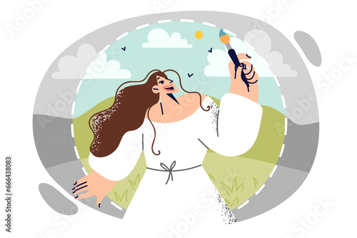 Woman with brush paints black and white nature around her, demonstrating desire to change world
