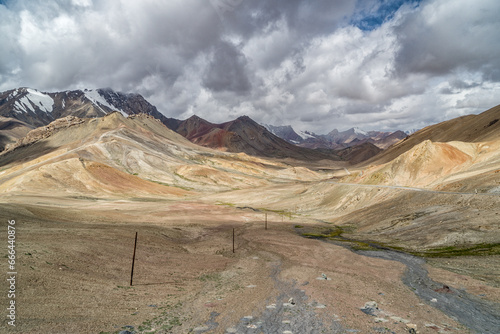 View of the Ak Baital peak and road on Pamir highway in Tajikistan. photo