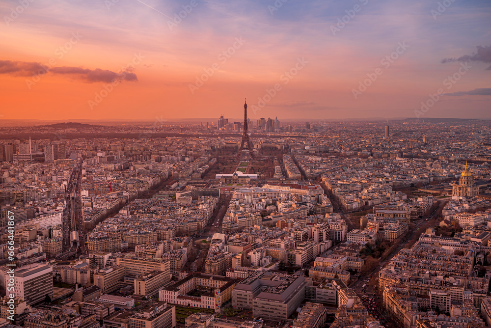 View of the Eiffel Tower and Paris skyline at sunset, France.