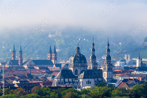 Germany, Bavaria, Wurzburg,Fog gathering over St John in Stift Haug photo