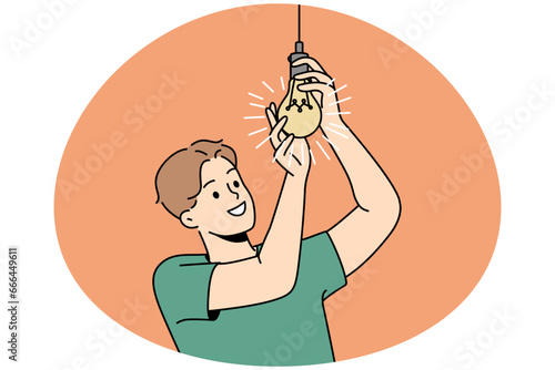 Smiling young man screwing lightbulb at home. Happy guy connect light bulb for light indoors. Vector illustration.