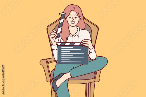 Woman film producer holds clapperboard and smiles sitting in chair to invite actors to participate in casting. Girl director demonstrates clapperboard after completing shooting of next take