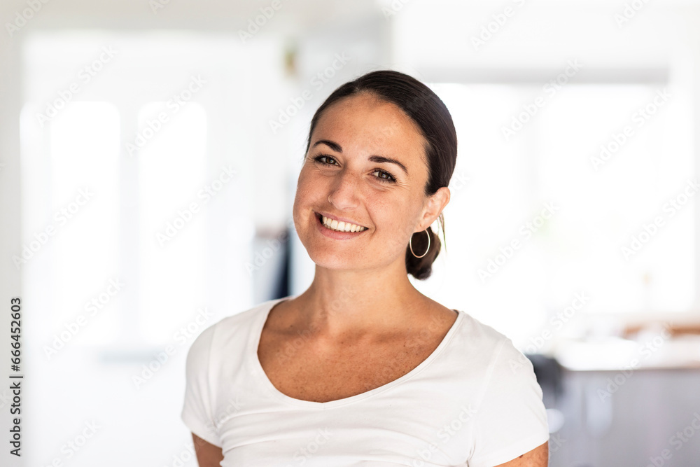 Happy woman wearing white t-shirt at home Happy woman wearing white t-shirt at home