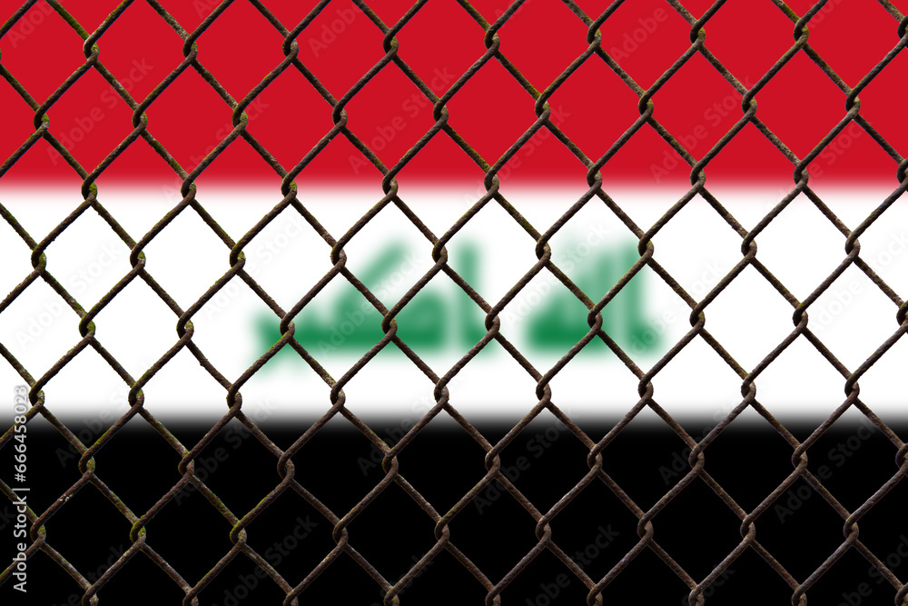Fototapeta premium A steel mesh against the background of the flag Iraq.