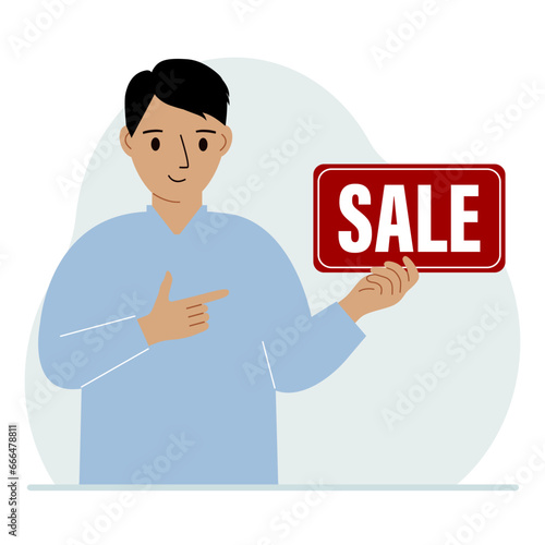 A man holds a banner with the text sale. Points a finger at the text. The concept of a discount, a special offer in a store or a bank, an advertising flyer.