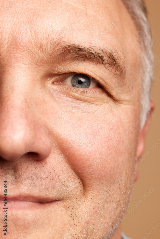 Close-up cropped photo of middle aged, 45s man isolated beige studio background.