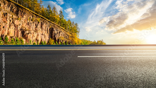 Highway road and mountain with beautiful sky sunset clouds in autumn