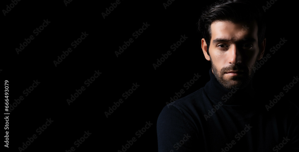 Bearded handsome young cool business man portrait Attractive bearded confident guy planning something looking at camera Smart man stand in the dark room Confident Cool man looking at camera copy space - obrazy, fototapety, plakaty 
