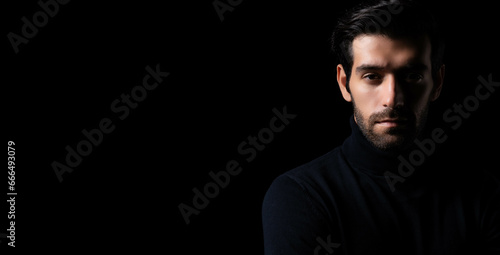 Bearded handsome young cool business man portrait Attractive bearded confident guy planning something looking at camera Smart man stand in the dark room Confident Cool man looking at camera copy space