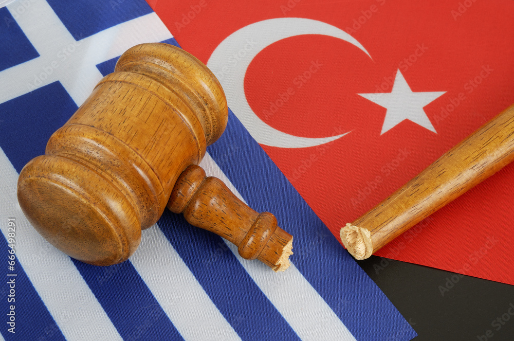 Problems between Greece and Turkey concept. Broken gavel and flags of Turkey and Greece.  