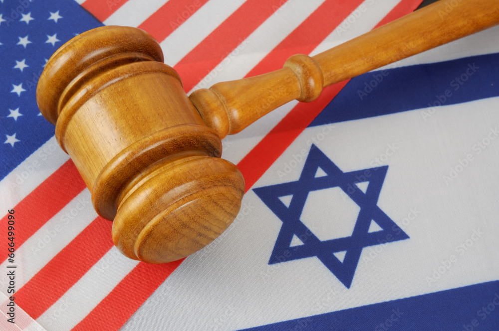 USA and Israel collaboration and agreement concept. Judge gavel on US and Israel flags.
