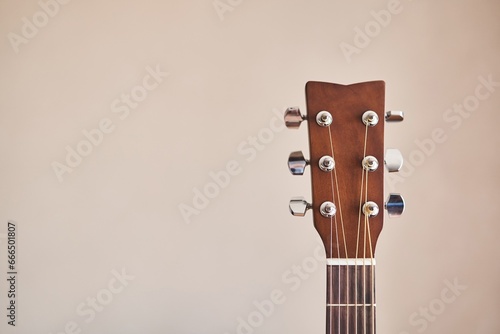 Acoustic guitar headboard with pegs. Guitar fretboard. Fretboard acoustic guitar. Close-up. Hobby