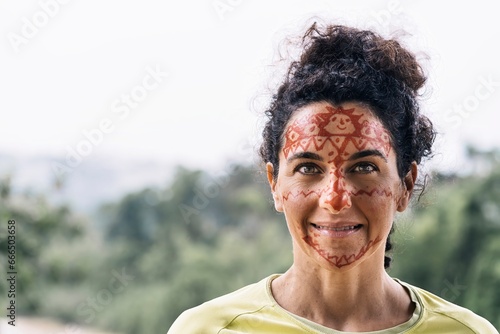 Smiling mature female with painting on face photo