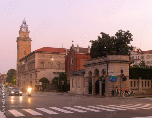 Bergamo street scene showing the Torre dei Caduti at dusk