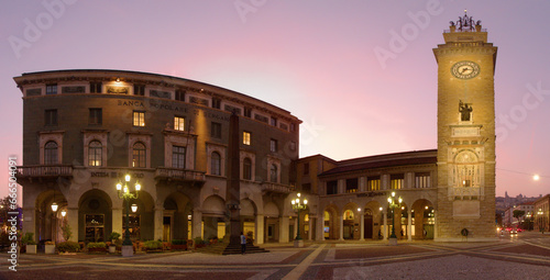 Banco Popolare di Bergamo showing the Torre dei Caduti at dusk photo
