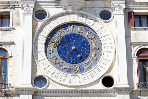 St Mark's Clock tower on Piazza San Marco, Lion of Saint Mark relief on facade, Venice, Italy
