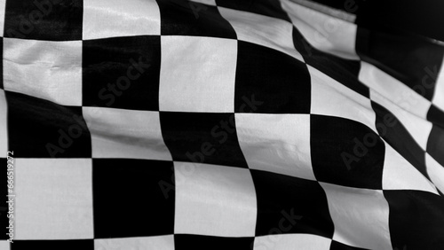 Checkered Race Flag. Freeze Motion Wavy closeup fabric fluttering Racing Flags background. Formula One flag car motor sport.
