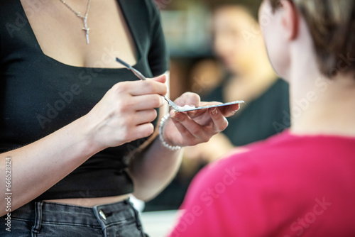 Young woman working as a stylist