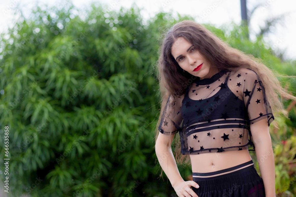 Beautiful transgender woman with long hair in the city Beautiful transgender woman with long hair in the city