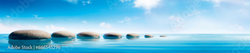 Stone in water blue sky grey stones clouds panorama large picture