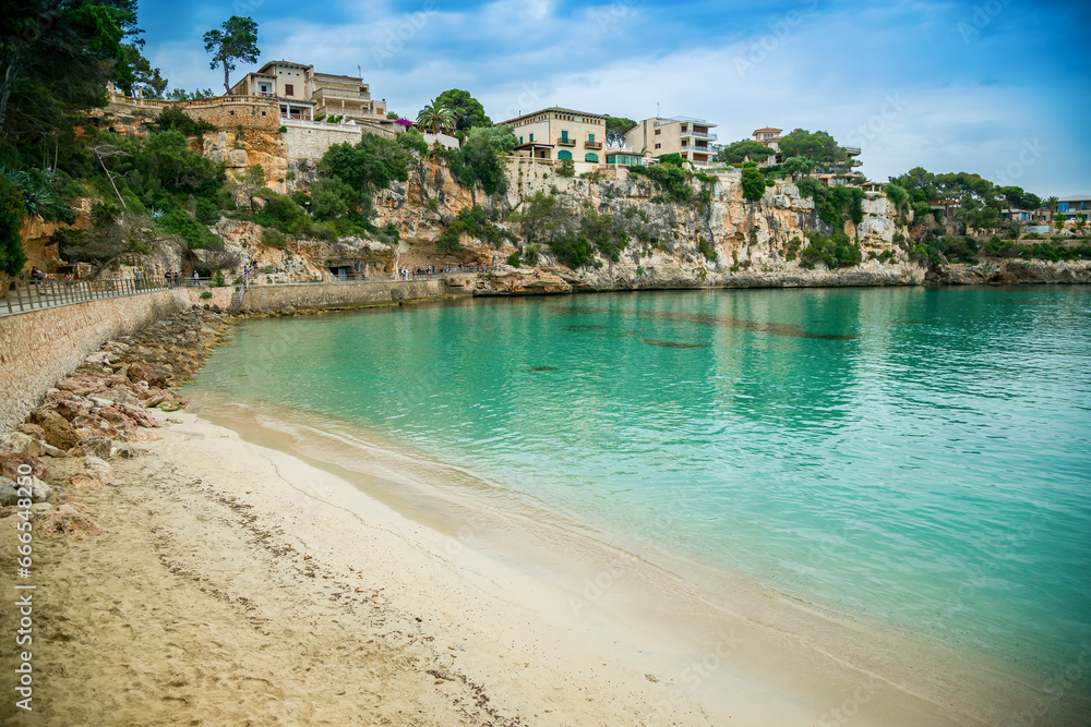 Sandy shores and crystal clear waters at Porto Cristo beach, Mallorca