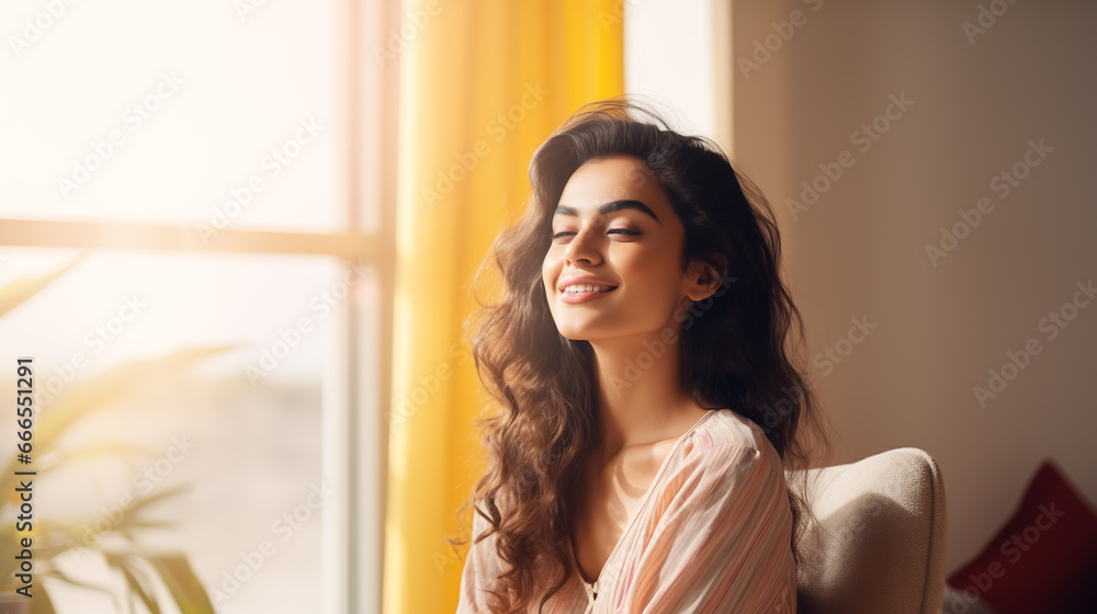 Relaxed Indian Woman Enjoying Wellbeing in Modern Home Interior near window Relaxed Indian Woman Enjoying Wellbeing in Modern Home Interior near window