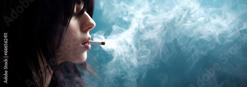 Teenager smokes cigarette. Substance abuse, addiction, people and bad habits concept close up of young man or girl smoking cigarette copy space.