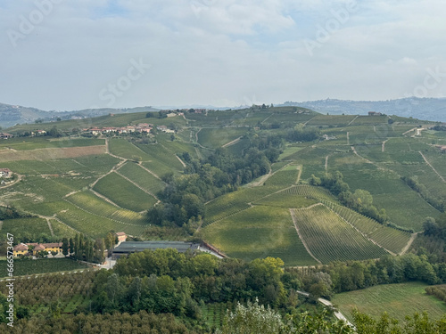 Italian landscape in Langhe and Monferrato  vineyards are visible on the hills.