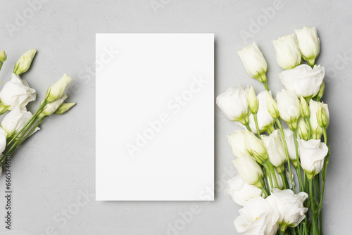 Blank wedding invitation card mockup with white flowers