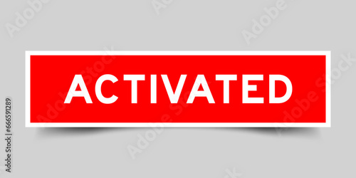 Sticker label with word activated in red color on gray background