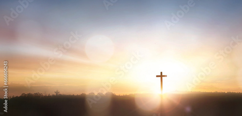 The cross on mountain sunset background