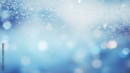 Christmas background blue blurred with delicate snowflakes