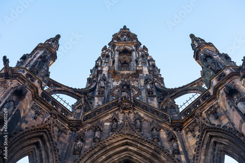 A low angle view of the Sir Walter Scott Monument in Edinburgh, Scotland. Clear blue sky Background.