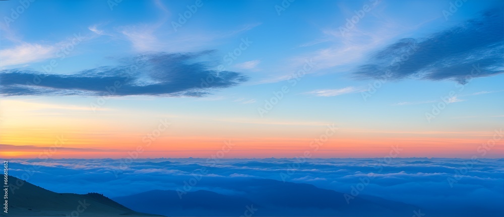 View from top of the mountain with blue colored clouds with sunset from Generative AI