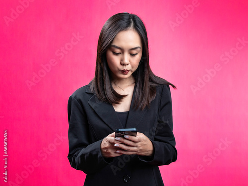 person, woman, indonesian, portrait, business, female, isolated, young, studio, smile, phone, pretty, businesswoman, confident, joy, smartphone, success, lady, face, technology, white, standing, using