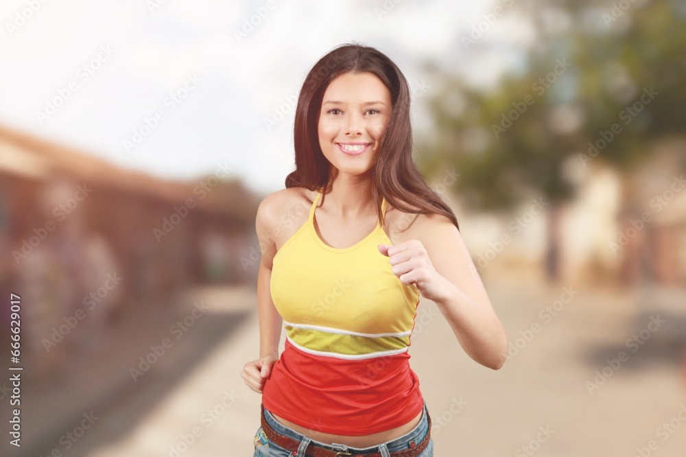 Sporty young woman running for workout